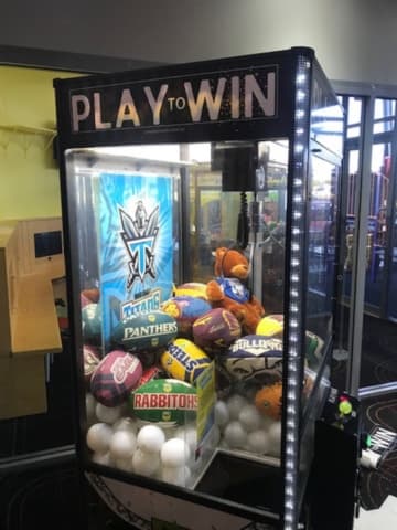Play to Win claw machine with NRL Panthers branded prizes